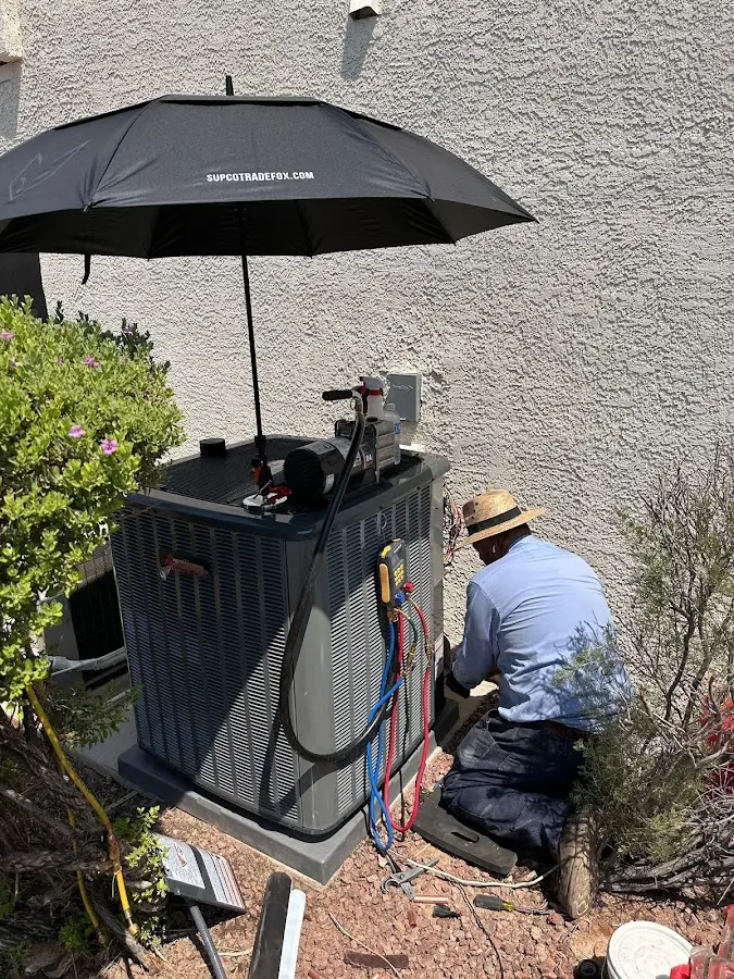HVAC technician performing outdoor AC maintenance in Surf City